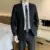 Two-button black suit + suit pants with tie belt